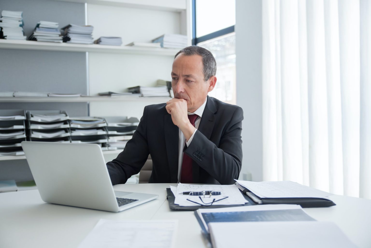 Lawyer look at his laptop